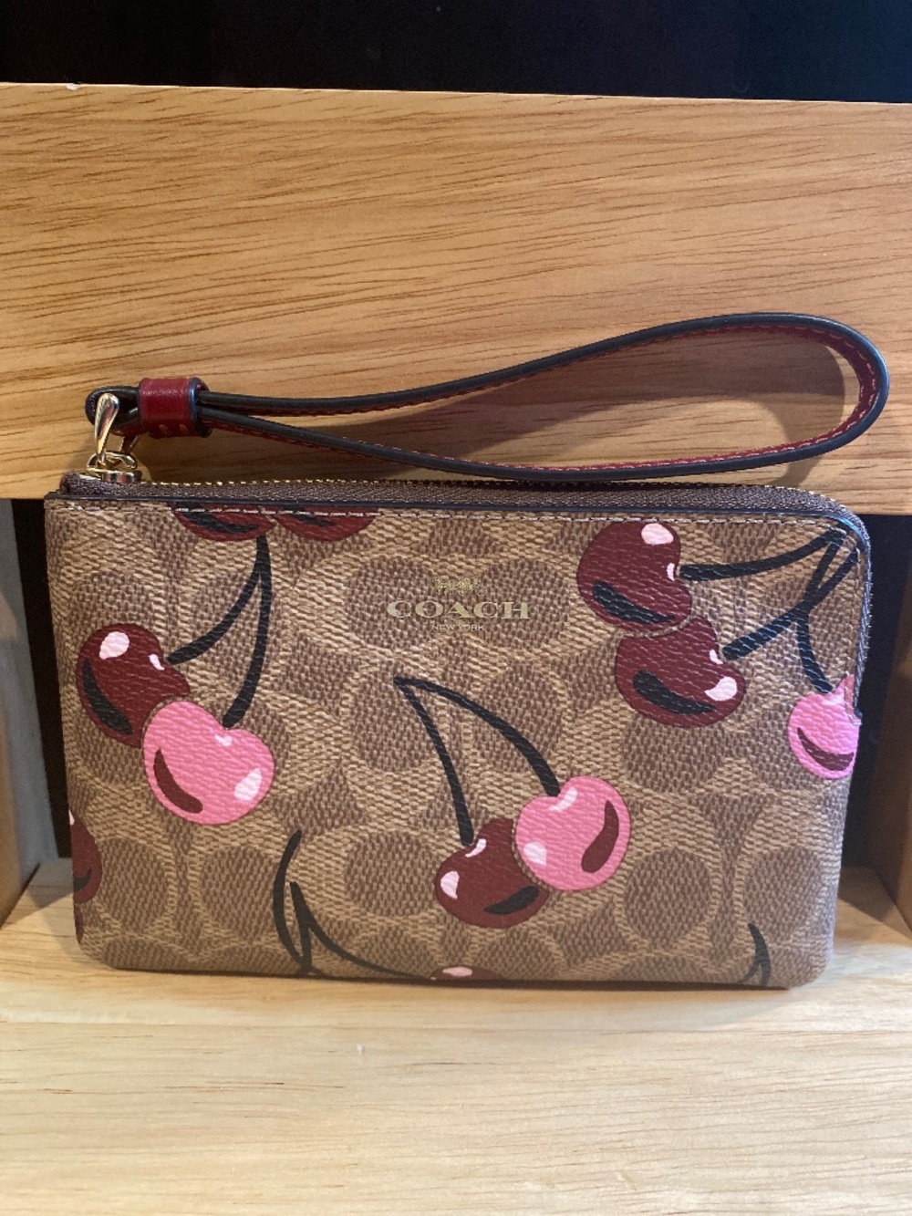 Coach corner zip wristlet in signature cherry print